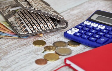 wallet and money, euro bills and cents, notebook calendar and calculator