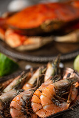 Close-up view of boiled shrimps on seafood background. Concept of delicious meal from the sea. Healthy food. Traditional islands dish.