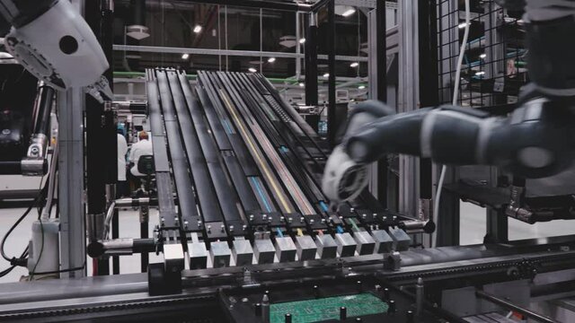 Robotic Arm Creating Microchip Electronics Close Up Macro Inside Factory