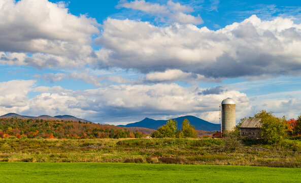 autumn landscape of Vermont farm with Jay Peak in the back ground 
