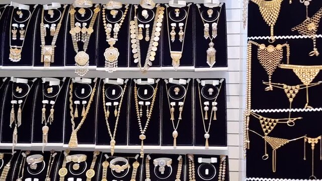 Panning video clip Inside a Gold Jewelry store in Gold Souk, a traditional market place Deira business district, Dubai.