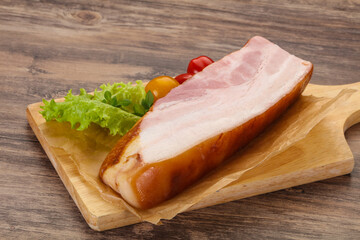 Smoked pork breast with salad leaves