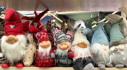 Elves in the shop window. Small cute handmade toys for a gift.Christmas souvenir.