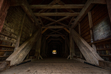 Fototapeta na wymiar Historic wooden bridge at the hiking trail near the Beuron monastery in the Danube valley