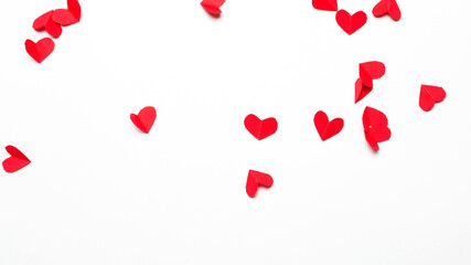 Small cut paper hearts on white background. copy space