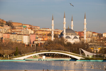 mosque and bridge with reflection in water, sunset in Ankara, Turkey
