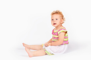 little girl with curly hair on a light background