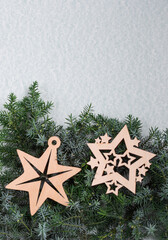 Christmas stars on needles of Christmas tree top view. Christmas card with New Year's decor. Vertical orientation