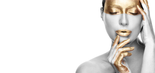 Gold based anti aging skincare concept. Beautiful model woman with gold treatment