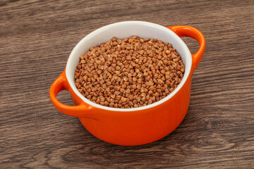 Raw buсkwheat cereal in the bowl