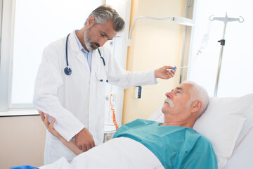 a doctor assisting senior patient