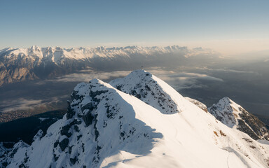 Winter panoramic view of gorgeous pink sunrise over glacier and high mountain peaks in the Alps....