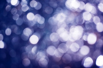 Abstract blue-violet background with bokeh. Holiday Christmas and New Year. Template for design. Magic concept.