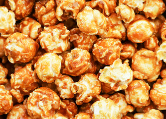 Caramelized popcorn, popcorn background. The view from top