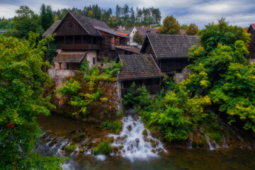 Fototapeta na wymiar Rastoke village with a lot of waterfalls. Slunj. Croatia. August 2020, long exposure picture.
