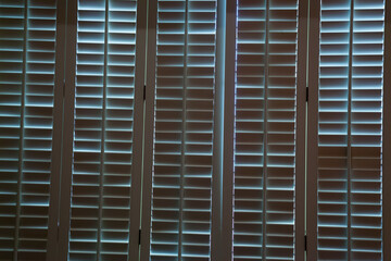 Window with wooden slotted shutters