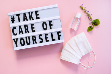 Lightbox with words Take Care of Yourself on pink background