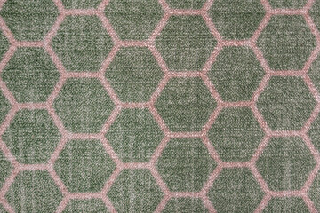 abstract background of green carpet with honeycomb pattern texture close up