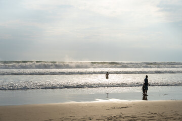 Waves in Kuta beach in Bali on a sunny day