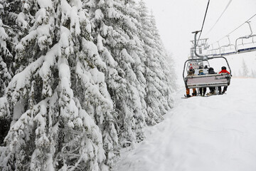 The skiers are on a cableway in Bukovel ski resort, Bukovel, Ukraine