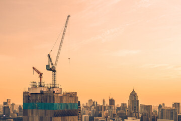 Large construction site including several cranes working on a building complex. Lots of tower Construction site with cranes and building