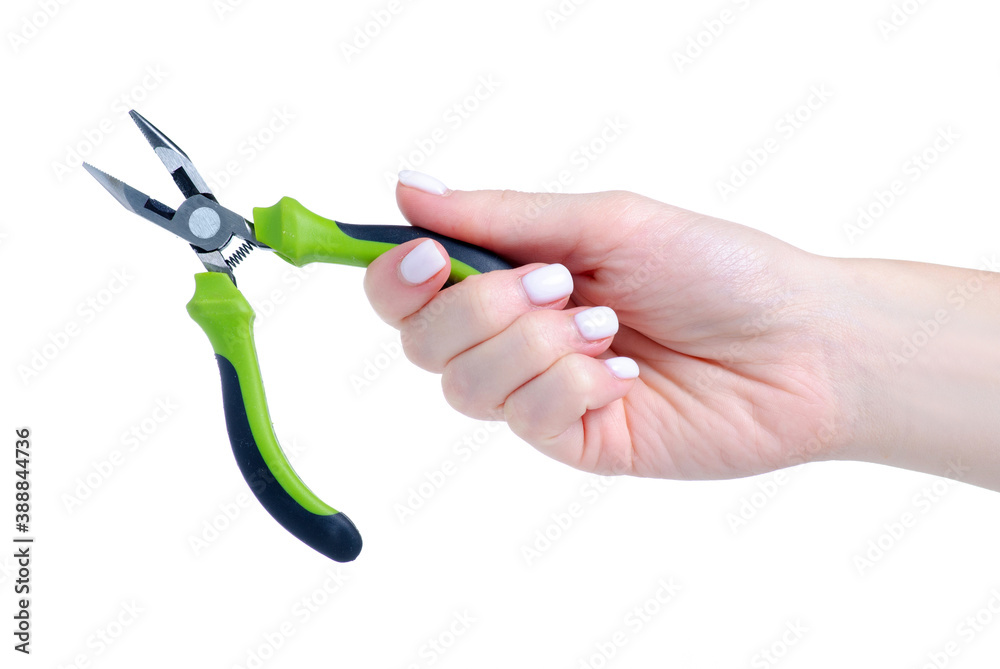 Wall mural green pliers work tool in hand on white background isolation