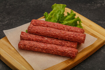 Raw beef sausages with spices