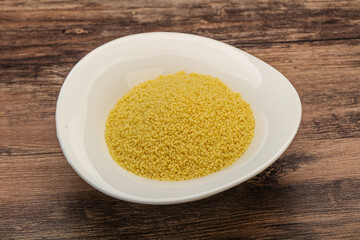 Raw cous cous heap in the bowl