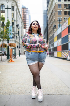 Portrait confident stylish beautiful woman on city sidewalk