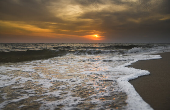 Lanscape of sunset sky beach and sea wave  with outdoor low lighting.