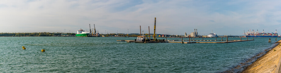 A panorama view along the River Test to the port of Southampton, UK in Autumn