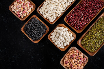 Various of organic beans on the wooden table