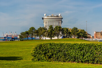 A view across Mayflower Park towards a Cruise ship laid up due to Covid 19 restrictions in Southampton, UK in Autumn