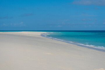 Fototapeta na wymiar Zanzibar. Empty beach at Snow-white sand bank of Nakupenda Island. Appearing just a few hours in a day