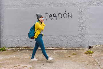 Young Girl Using Phone in Street