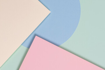 Abstract geometric texture background of fashion soft green, pastel pink, light blue, yellow color paper. Top view, flat lay