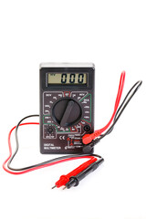Digital electrical tester multimeter in black case isolated on white background. Digital multimeters have a numeric display, can measure voltage, current and resistance. Close-up.