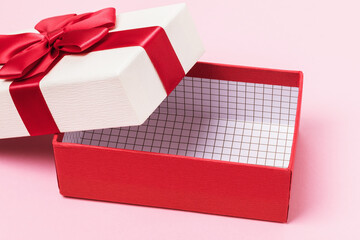 Empty gift box on a pink background close-up