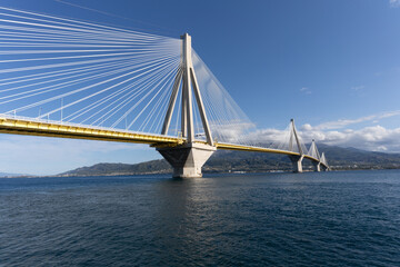 Fototapeta na wymiar The sublime Rio–Antirrio Bridge, one of the world's longest multi-span cable-stayed bridges and longest of the fully suspended type. It crosses the Gulf of Corinth near Patras, Greece