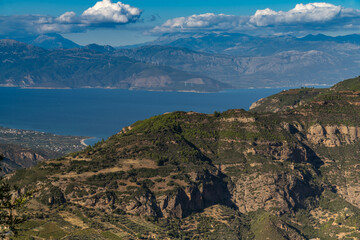 Dramatic sea and mountain landscapes along the backroads of the Northern Peloponnese Peninsula,...