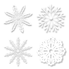 Paper snowflakes with soft shadows on a white background. realistic vector illustration.