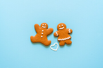 Gingerbread cookies isolated on a blue background. Christmas homemade cookies top view