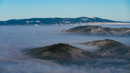 landscape with snow and low clouds