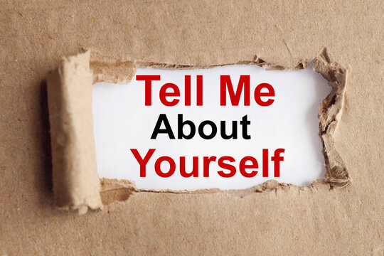 tell me about yourself, text on white paper on torn paper background