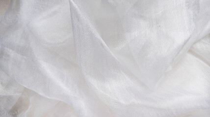 Photo of white silk draped. View from above. Abstract background. 