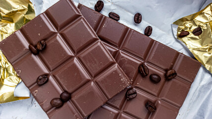 Photo of chocolate bar, coffee beans