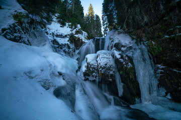 frozen waterfall in the forest
