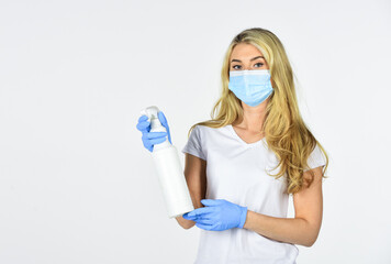 Disinfection concept. Risk being exposed coronavirus. Girl clean frequently touched surfaces. Personal hygiene. Cleaning and Disinfection. Wearing mask protect from coronavirus. Serious hygiene