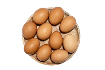 Brown raw chicken eggs on  wooden plate isolated on white background.