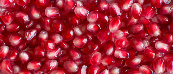 red grains of ripe pomegranate background
